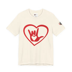 Beige t-shirt with a red heart design featuring a hand sign on a white background